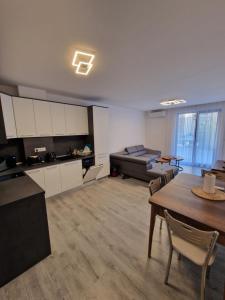a large living room with a couch and a table at Premium 2 bedroom flat at Millennium 2 in Sveti Vlas