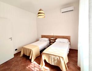 Кровать или кровати в номере Villa singola Amanda - 500m dal mare
