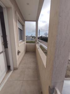 an empty hallway of a building with a door at Departamento sierras Balcarce in Balcarce
