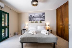 Ένα ή περισσότερα κρεβάτια σε δωμάτιο στο Fram Luxury Apartment - Via Leonardo Da Vinci