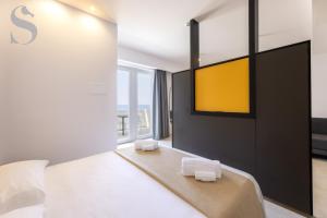 Ένα ή περισσότερα κρεβάτια σε δωμάτιο στο Sud Hotel Pulsano