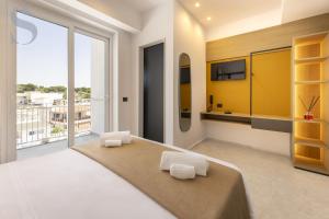 Ένα ή περισσότερα κρεβάτια σε δωμάτιο στο Sud Hotel Pulsano