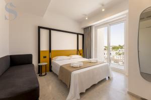 Postel nebo postele na pokoji v ubytování Sud Hotel Pulsano + 28 fotografií