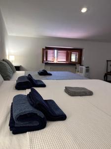 Postel nebo postele na pokoji v ubytování B&B RIO GRANDE