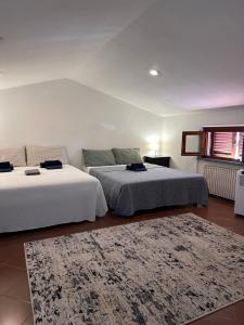Postel nebo postele na pokoji v ubytování B&B RIO GRANDE
