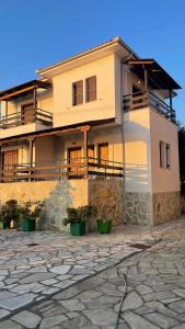 a building with balconies on the side of it at Anemos Pelion Seaview in Kala Nera