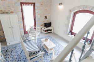 a living room with chairs and a table at Ampelos Tower in Kokkala