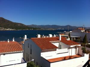 a view of the water from the roofs of houses at Hostal German in Port de la Selva