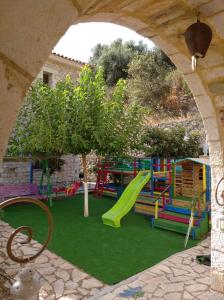 a colorful playground with a slide at Βίλλα Τρία Ποτάμια καταρράχτες ΝΈΔΑ 