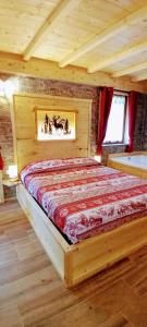 Postel nebo postele na pokoji v ubytování AL RANCH WELLNESS CADORE DOLOMITI APARTMENTS vicino Cortina Olimpiadi 2026 e Misurina Tre Cime Lavaredo