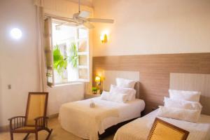 Postel nebo postele na pokoji v ubytování Hotel Boutique Don Pepe