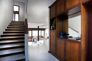 a hallway with a staircase in a house at VILLA SETTANTA Lago di Garda - Heated Pool on request in Bardolino
