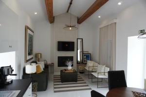 a living room with a couch and a table at Casa Amélia in Feteira Grande