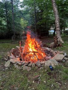 a fire pit in the middle of a field at Abundant Acres Retreat in Beech Mountain