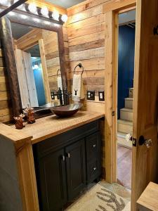 a bathroom with a sink and a mirror at Abundant Acres Retreat in Beech Mountain