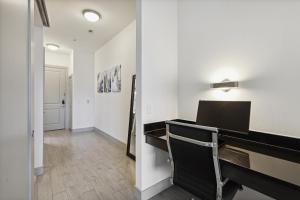 a room with a desk with a laptop on it at Stylish 1 Bedroom Apartment in Medical District in Dallas