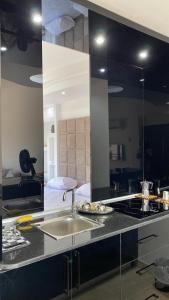 a kitchen with a sink and a counter top at Designer Apartment in Sunny Lakes 2 Sharm El Sheikh komplett renoviert auch für Langzeitmieter buchbar in Sharm El Sheikh