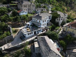 an aerial view of a large house in a village at Castle Hotel in Gjirokastër