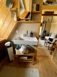 a bathroom with a sink in a tiny house at Fischerhaus Blankenese in Hamburg +57 photos