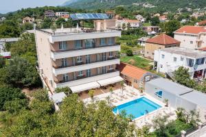 an aerial view of a building with a swimming pool at Villa La Vida in Budva