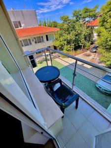 a balcony with a table and a chair on it at DebiMar in Chernomorets +28 photos