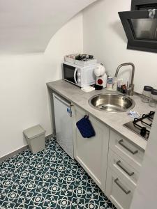 Cucina o angolo cottura di Cisternone Suites