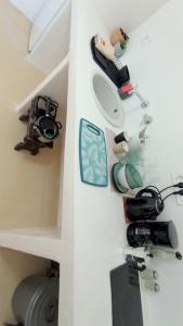 a room with a toilet and a camera on a wall at suite diminutif 2 in Adamas