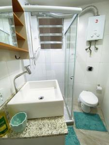 a bathroom with a sink and a toilet at Charme Copa Retreat próximo ao Copacabana Palace in Rio de Janeiro +20 photos
