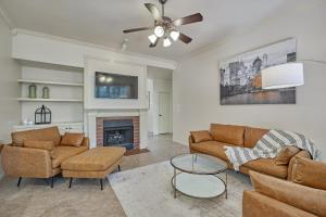 a living room with two couches and a fireplace at New! Pool, Spa, Nature Trails - The Woodlands 4BR Forest Retreat! in Spring