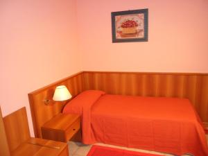 Postel nebo postele na pokoji v ubytování Hotel Ristorante Al Bassanello
