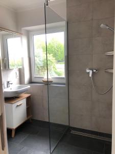 a bathroom with a shower and a sink at Ferienhof-Micheel-Haeuser-bis-7-Personen in Gammendorf