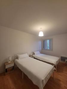 Ένα ή περισσότερα κρεβάτια σε δωμάτιο στο Maison de vacances en Périgord noir