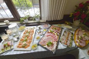 a table topped with lots of different types of food at Altdeutscher Hof Beckord in Gütersloh