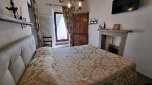 Posteľ alebo postele v izbe v ubytovaní La Torre del Vicario