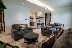 a living room with a couch and chairs and a table at Paradise of North Riyadh جنة شمال الرياض in Riyadh