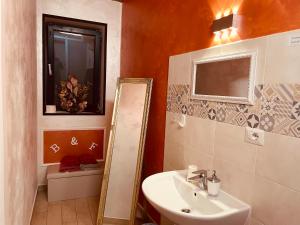 a bathroom with a sink and a mirror at Castelpetroso Bed&Food in Castelpetroso +8 photos
