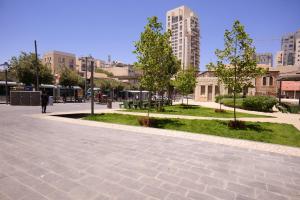 a person walking down a street in a city at 2BDR Suite#Next To The Market#Best Location in Jerusalem