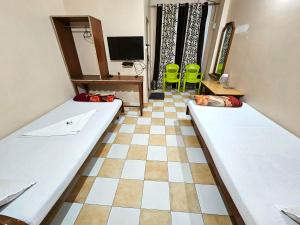 מיטה או מיטות בחדר ב-Hotel Rishiraj