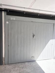 a garage door with the number on it at baiasole in Sanremo +14 photos