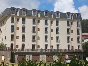 a large white building with a balcony at LoriCalabria-Appartamento Lorica in Lorica