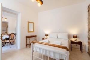 Ένα ή περισσότερα κρεβάτια σε δωμάτιο στο Michael's apartment Filoti +40 φωτογραφίες