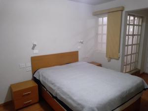 A bed or beds in a room at La Cima