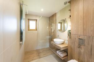a bathroom with a sink and a glass shower at Domek pod Magurką in Międzybrodzie Bialskie +17 photos