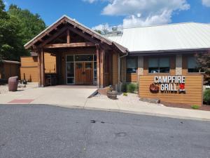 a building with a sign that reads campfire chili at Woodstone at Massanutten in Massanutten