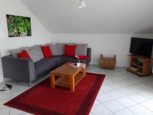a living room with a couch and a coffee table at Ferienwohnung-Christa-Salem in Salem