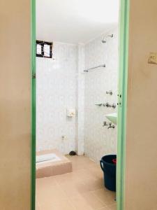 a bathroom with a tub and a toilet in a room at Modern 3 Bedroom Flat in Sylhet in Sylhet