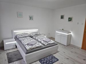 a bedroom with a bed and two night stands at Kukabura in Katowice