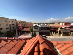 a view of a city from the roof of a building at Villa ML in Los Mameyes