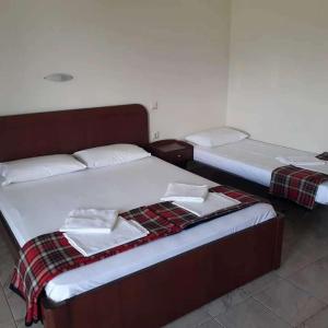 Postel nebo postele na pokoji v ubytování Christos Rooms