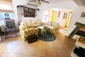 a living room with a couch and a table at House near Marina, Yachts, Boats. 4,5 BR in Torba